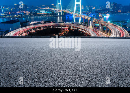 Empty road and Nanpu bridge at night in Shanghai,China Stock Photo