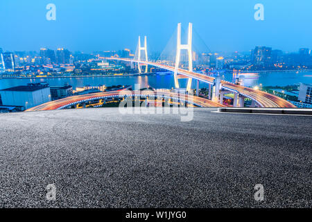 Empty road and Nanpu bridge at night in Shanghai,China Stock Photo