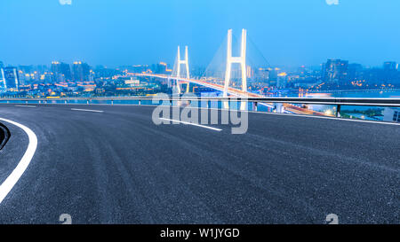 Empty highway and Nanpu bridge at night in Shanghai,China Stock Photo