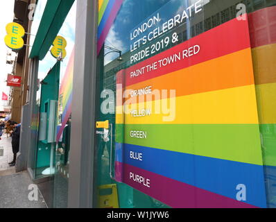 London, UK. 2nd July, 2019. Rainbow display seen outside EE Phone store.Many retail stores in the capital's shopping heartland of the West End are currently decorated in rainbow colours, supporting Pride. An annual celebration of the LGBT community, Pride culminates in the LGBT Pride parade in London, attracting many thousands of visitors to the capital, with a colourful, vibrant and eccentric procession through the city. Credit: Keith Mayhew/SOPA Images/ZUMA Wire/Alamy Live News Stock Photo