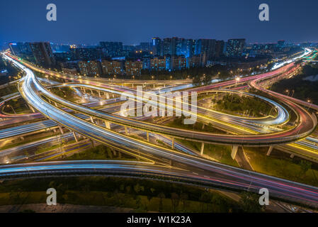 Large interchange with busy traffic aerial view at night in Chengdu, China Stock Photo