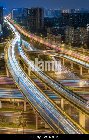Large interchange with busy traffic aerial view at night in Chengdu, China Stock Photo