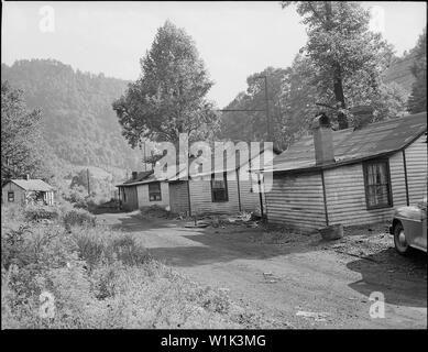 Typical three room houses at Big Sandy. Miners are charged $8 monthly for bus transportation to the mines at Exeter. Kingston Pocahontas Coal Company, Exeter Mine, Welch, McDowell County, West Virginia. Stock Photo