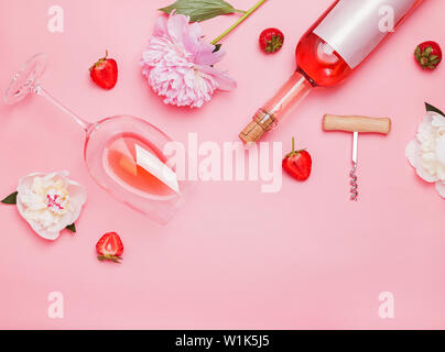 Creative composition with rose wine and delicious strawberries on the pink background, top view Stock Photo