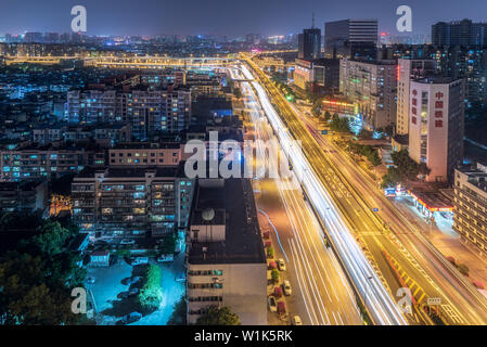 Chengdu, Sichuan province, China - June 3, 2019 : Busy car traffic on ChengWenLiJiao interchange aerial view at night in QingYangQu district Stock Photo