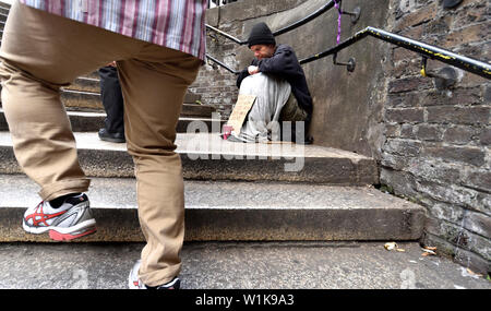 London, England, UK. Homeless man on the steps down to Borough Market, Southwark Stock Photo