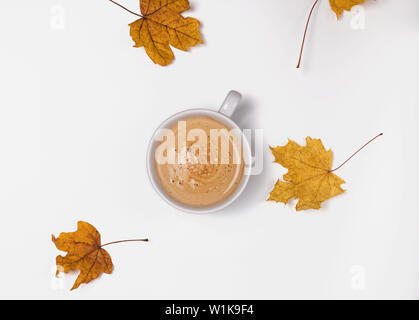 Cup of coffee and yellow leaves isolated on the white background Stock Photo