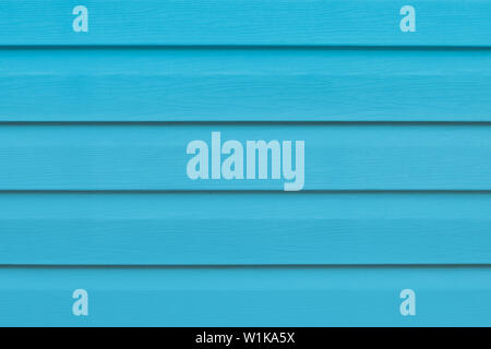 Blue bright wooden boards close-up. Striped panel, surface, background. Plank - timber. Blue painted wood table in lines. Abstract pattern of fence Stock Photo