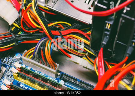 power interface on the motherboard and SATA 2 with connected RAM wires and hard drives Stock Photo