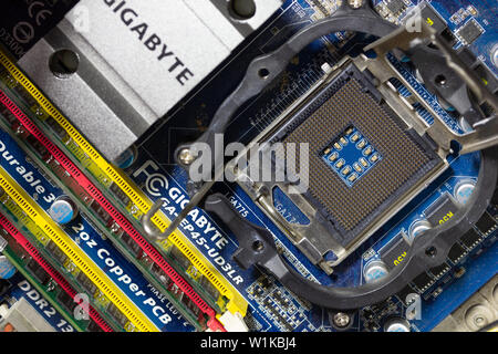 Maykop, Russia - September 17, 2016: empty socket Intel CPU on Gigabit motherboard, top view close-up Stock Photo