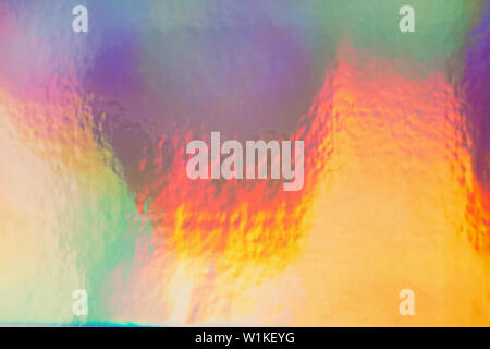 Holographic foil paper close-up. Modern trendy colorful background Stock Photo