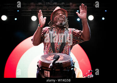 Leon Mobley, percussionist of the Innocent Criminals, performing live on stage together with Ben Harper at the Gruvillage Festival in Grugliasco, near Stock Photo
