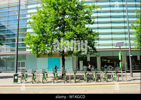 City Bike stand in front of John Lewis store in Liverpool One shopping area, Merseyside Stock Photo