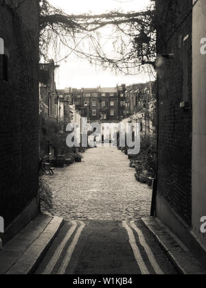 London, England - December 15 2014:   Sepia toned image of an old side street in London Stock Photo