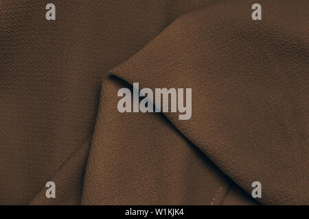 dark brown fabric silk texture background close-up Stock Photo