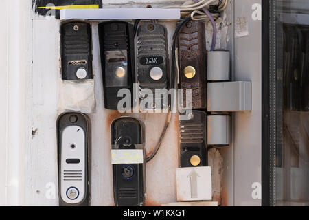 Description: Ring Intercom outdoors on white plastered wall with call and camera. Close up Stock Photo