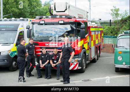 Line of UK fire brigade emergency response vehicles outside of ...