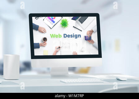 Web, app design studio concept with computer display and web design text. Concept of web team office. Stock Photo