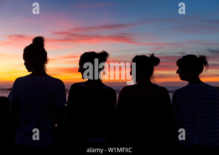 Women enjoying the sunset, Essaouira, Morocco Stock Photo