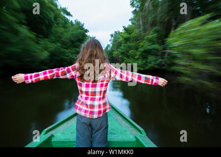 girl on boat trip in Mangroves, Caroni Swamps, Trinidad, West Indies, Caribbean, South America Stock Photo