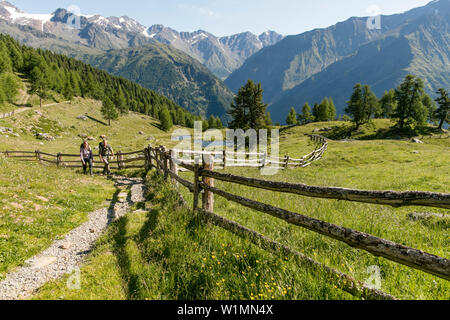 Couple hiking in the mountains Stock Photo