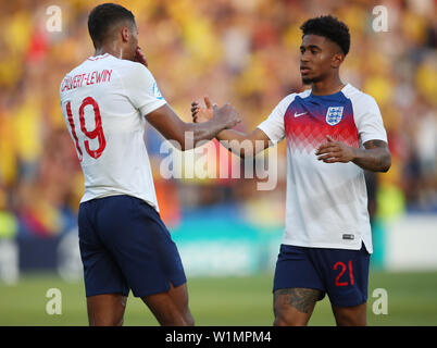 England's Dominic Calvert-Lewin (left) and Reiss Nelson (right) battle for the ball Stock Photo