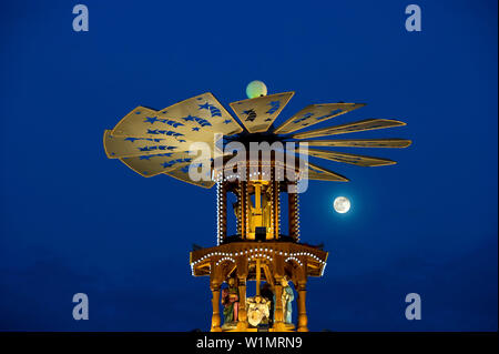 Christmas pyramid with full moon at the Christmas market, Karlsruhe, Baden-Wuerttemberg, Germany Stock Photo