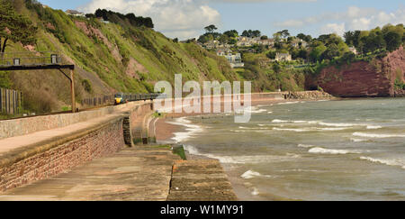 Holcombe beach at Teignmouth, as a GWR Inter-city express approaches, headed by power car No 802106, 04.05.2019. Stock Photo