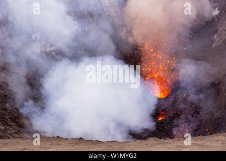 Look inside the active volcano Yasur during a lava eruption. Lava and emitting gases, Vanuatu, Tanna Island, South Pacific Stock Photo