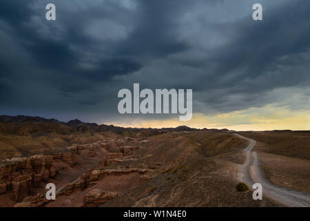 Upcoming thunderstorm over trail above Sharyn Canyon, Sharyn National Park, Almaty region, Kazakhstan, Central Asia, Asia Stock Photo