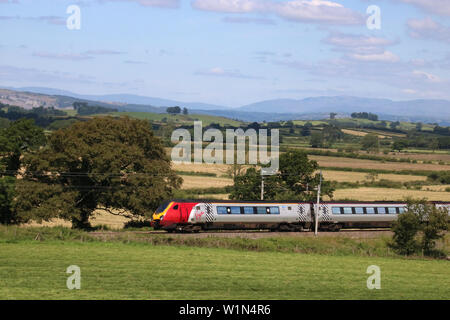 Virgin West Coast super voyager class 221 dmu on West Coast Main Line railway passing Holme in Cumbria with a Glasgow to London train 3rd July 2019. Stock Photo