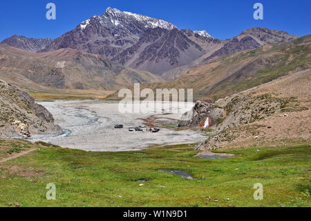 'mountain landscape with valley, waterfall and colorful lagoons, Termas del plomo, Valle del Yeso, Cajon del Maipo, Región Metropolitana de Santiago, Stock Photo