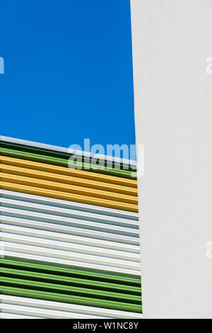 Coloured horizontal stripes as a covering at a car park radiating a graphic effect, Hamburg, Harburg, Germany Stock Photo