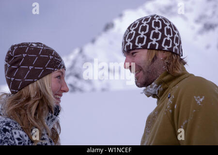 Young couple standing close together, in winter scenery, Kuehtai, Tyrol, Austria Stock Photo