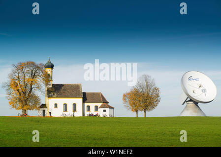 St. Johann Chapel and parabolic Antenna Satellite Dish in Raisting at the earth station, Raisting, Bavaria, Germany Stock Photo