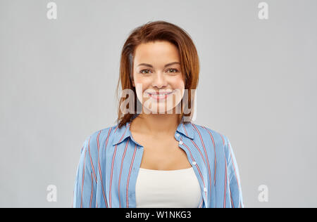happy smiling woman in striped shirt Stock Photo