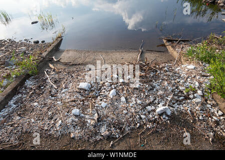 Polystyrene, styrofoam garbage on the shore. Stock Photo