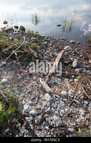 Polystyrene, styrofoam garbage on the shore. Stock Photo