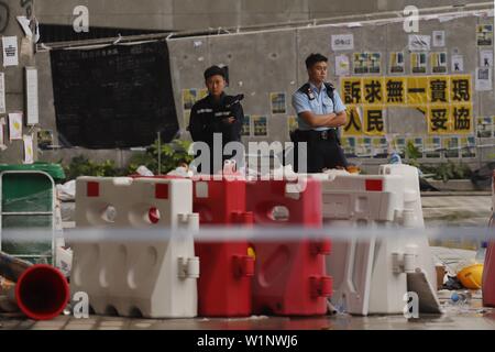 Hong Kong, CHINA. 3rd July, 2019. Policemen and women stand guard outside vandalized HKSAR Government Headquarters.July-3, 2019 Hong Kong.ZUMA/Liau Chung-ren Credit: Liau Chung-ren/ZUMA Wire/Alamy Live News Stock Photo