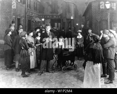 TYRONE POWER SR as Street Preacher and CAROL DEMPSTER as Gypsy Fair (at organ) in DREAM STREET 1921 director D. W. GRIFFITH story Thomas Burke Silent Movie D.W. Griffith Productions / United Artists Stock Photo