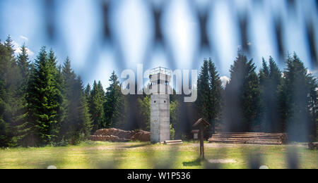 01 July 2019, Saxony-Anhalt, Sorge: View through the old border fence to a former watchtower in the border museum. The museum is located directly on the Green Belt. Photo: Klaus-Dietmar Gabbert/dpa-Zentralbild/ZB
