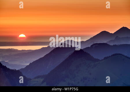 Sunrise above lake Chiemsee and Chiemgau Alps, from Seebergkopf, Mangfall Mountains, Bavarian Alps, Upper Bavaria, Bavaria, Germany Stock Photo