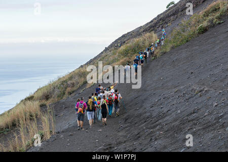 tourists climbing Stromboli Volcano, Stromboli Island, Aeolian Islands, Lipari Islands, Tyrrhenian Sea, Mediterranean Sea, Italy, Europe Stock Photo