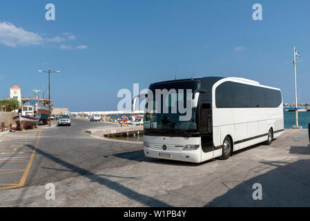 Ierapetra, Crete, Greece. June 2019. Tourist coach waiting in the harbour area of this Cretan town, Ierapetra southern Crete. Stock Photo