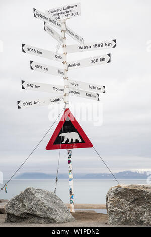 Attention polar bears - warning sign next to the entrance of Longyearbyen airport, Spitzbergen, Svalbard Stock Photo