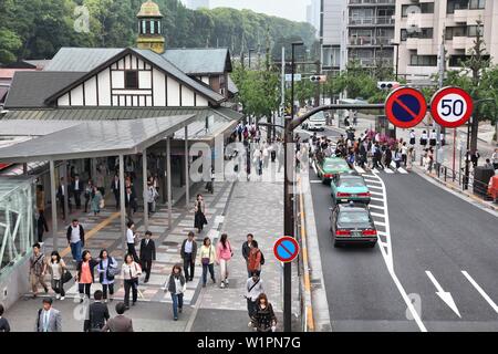 TOKYO, JAPAN - MAY 9, 2012: People visit Harajuku Station in Tokyo, Japan. Tokyo is the capital city of Japan and the most populous metropolitan area Stock Photo