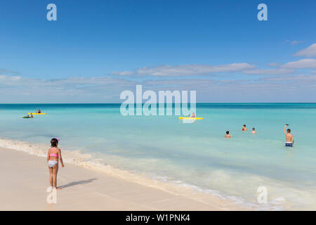 Tourists on Cayo Coco beach, sandy dream beach, turquoise blue sea, snorkeling, swimming, Memories Flamenco Beach Resort, hotel, family travel to Cuba Stock Photo