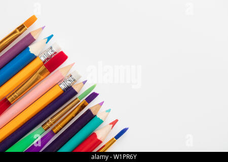 Row of school art and craft supplies on a white background Stock Photo