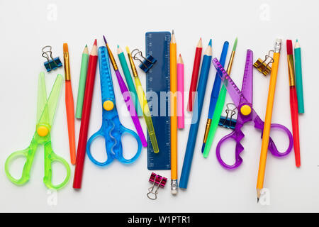 A large set of school art supplies on a plain white background Stock Photo