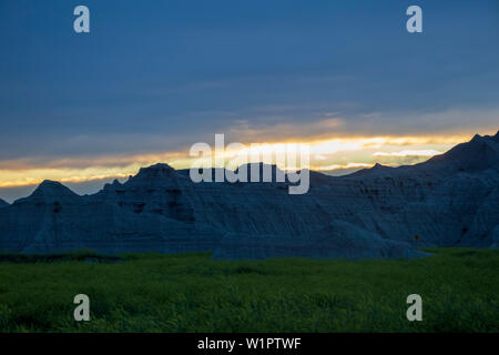 Sunset over desert rock formations Stock Photo